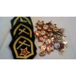 Soviet era military badges including: Cap badges, Collar badges, day badges, cloth patches including