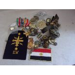 A collection of mixed militaria, British Military buttons and badges (some need repair, chin scales,