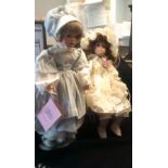 Vintage collectable Doll's (2)- Paradise collection porcelain one sitting on stall (1) standing on