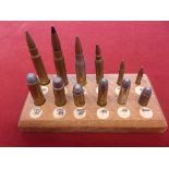 Bullet Display board, a selection of twelve rounds ranging from .22 to .303, Colt 45, 9mm etc. A