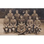 Middlesex Regiment WWI Postcard, group photo with Officer in the middle and mascot dog at the side.