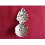 The Lancashire Fusiliers Regiment Other Ranks Head Dress Badge for the Raccoon-skin cap, (Brass) two