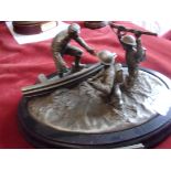 Dunkirk 1940 Figure by the Danbury Mint, depicts a sailor aiding British soldiers onto ship to