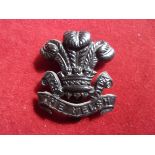 7th (Cyclist) Battalion, The Welsh Regiment WWI Cap Badge (Blackened-brass), slider. K&K: 1865