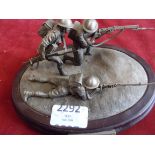 The Desert Rats Pewter Figure by the Danbury Mint, depicts three British Infantrymen pushing the