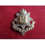 East Surrey Regiment WWI War Economy Forage Cap Badge (Brass), slider. K&K: 640