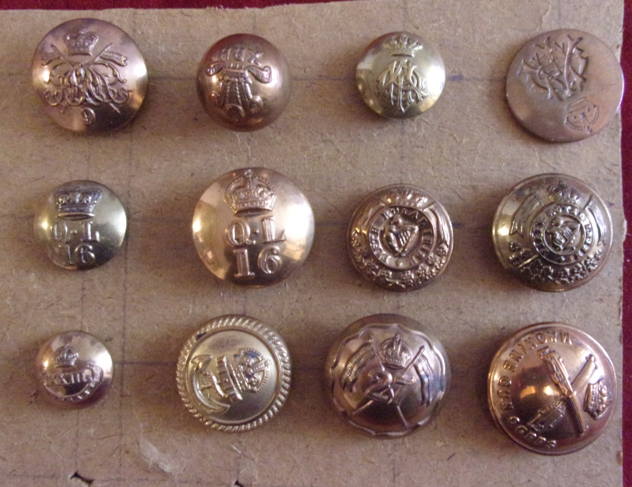 British Military Buttons (12) ranging from Victorian to WWI including: 5th Royal Irish, Queen's 16th