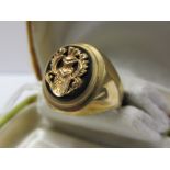 9ctYELLOW GOLD SIGNET RING set with black onyx and gold crest 50, 8 grams in weight
