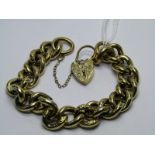 9ct YELLOW GOLD CURB LINK BRACELET WITH SAFETY CHAIN AND HEART PADLOCK CLASP; foliate decoration