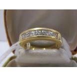 18ct YELLOW GOLD PRINCESS CUT DIAMOND HALF ETERNITY STYLE RING, set with 7 matched princess cut