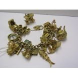 HEAVY 9ct GOLD CHARM BRACELET, approx 133 grams, inc opening carriage, teapot, car, lantern,