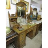 EDWARDIAN OAK DRESSING TABLE; A triple mirrored back twin pedestal dressing table fitted 9 drawers