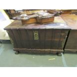 AFRICAN STINKWOOD TRUNK, ornate brass mounted lift top trunk with heavy carrying handles and lock