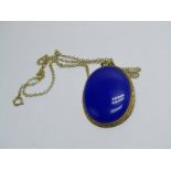 9ct YELLOW GOLD BLUE STONE SET PENDANT; On 9ct gold chain