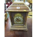 CONTINENTAL BRACKET CLOCK, oak architectural cased bracket clock with gilt arch face and coiled