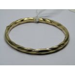 9ct YELLOW GOLD HINGED BANGLE of twist form, 12grams