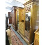 EDWARDIAN WARDROBE COMPACTUM, an impressive elm and oak twin mirrored door compactum with ornate