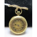 18ct YELLOW GOLD LADIES FOB WATCH; on 9ct gold ribbon brooch