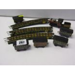 TIN PLATE RAILWAY, Japanese tin plate locomotive with 5 carriages together with 3 sections of German