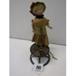 EARLY DOLL, an early 20th Century Continental bisque doll on gyroscope-style spinning base, 7.5"