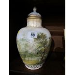 CONTINENTAL PORCELAIN VASE, a gilt lidded 10.5 vase, decorated with continuous riverscape (finial