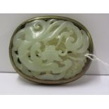 CARVED JADE BROOCH, dragon form set in gilt mount