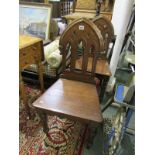 VICTORIAN HALL CHAIRS, pair of oak gothic arched back hall chairs with tapering octagonal legs