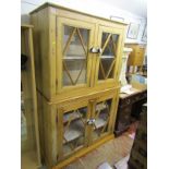 ANTIQUE PINE CABINET, a 4 door glazed 2 section cabinet, 45" width