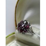 18ct WHITE GOLD ALMANDINE GARNET AND DIAMOND RING; size O/P, 8.3 grms in weight