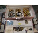 COSTUME JEWELLERY; A pink jewellery box containing a selection of necklaces, bracelets, rings etc