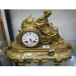FRENCH MANTEL CLOCK, 19th Century gilt metal mantel clock with seated lady cresting and coiled bar