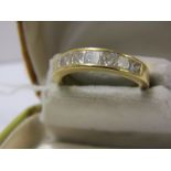 18ct YELLOW GOLD 7 STONE DIAMOND HALF ETERNITY RING, 7 chanel set princess cut diamonds of good