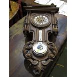 CONTINETAL CLOCK WITH COMBINED BAROMETER, ornate foliate and pillar carved surround combined clock