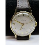 9ct YELLOW GOLD GENTLEMAN'S EVERITE 17 JEWEL MANUAL WIND WRIST WATCH on leather strap, appears in