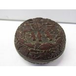 CINNABAR LACQUER, a Chinese carved cinnabar circular lidded box with signed base, 4.5" dia