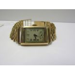 9ct YELLOW GOLD CASED ART DECO DESIGN WRIST WATCH on 9ct yellow gold link bracelet with 15 jewel
