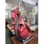 DRAGON, an amusing carved gilt wood painted red dragon, 43" height