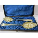 GEORGIAN SILVER BERRY SPOONS, cased pair HM silver gilt fruit embossed berry spoons, Exeter 1807