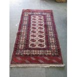 EASTERN RUG, cream ground Turcoman-design rug with gul field