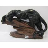 PANTHER, a painted plaster sculpture of a Panther on rocky outcrop, indistinctly signed, 10" height