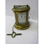 MINIATURE CARRIAGE CLOCK, oval brass cased carriage clock with key, 3" height