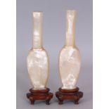 A GOOD UNUSUAL PAIR OF 19TH CENTURY CHINESE MOTHER-OF-PEARL VASES, on fixed wood stands, each