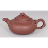 A 19TH/20TH CENTURY CHINESE YIXING POTTERY TEAPOT & COVER, the sides and cover moulded with sprigs