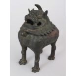 A CHINESE MING STYLE BRONZE BUDDHISTIC LION BRONZE CENSER, the head forming a hinged cover, 5.1in