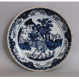 A CHINESE BLUE & WHITE PORCELAIN SAUCER DISH, the interior decorated with a kylin, 11.3in diameter.