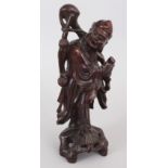 AN EARLY 20TH CENTURY CHINESE CARVED WOOD FIGURE OF AN IMMORTAL, 12.1in high.