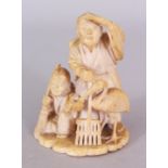 A SIGNED JAPANESE MEIJI PERIOD IVORY OKIMONO OF A HUSBAND & WIFE, in the company of a stork, the