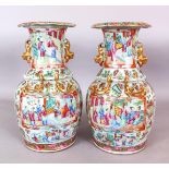 A GOOD LARGE PAIR OF 19TH CENTURY CHINESE CANTON PORCELAIN VASES, the sides of each painted with