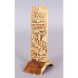 AN EARLY 20TH CENTURY CHINESE IVORY CARVING, on a fixed curved stand, depicting hunters lead by a