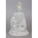 AN 18TH CENTURY CHINESE BLANC-DE-CHINE PORCELAIN FIGURE OF GUANYIN, seated in meditation and bearing